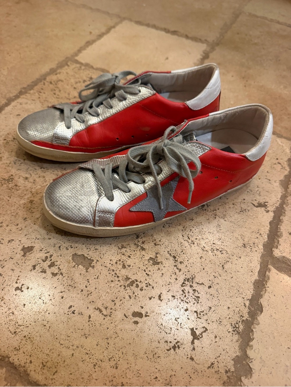 Red and silver golden goose sneakers